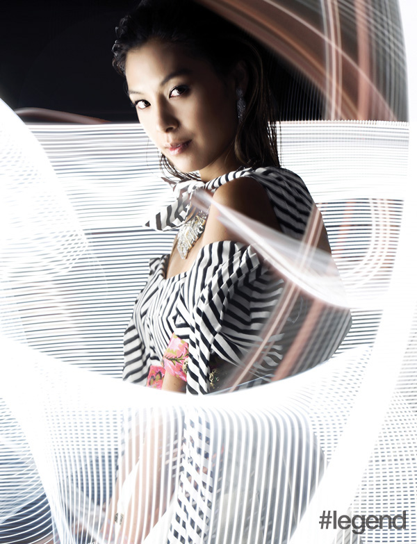 Alison Chan-El Azar wearing earings by Narcisa Pheres for Jewelry Maki, necklace by Swarovski and top by Dolce & Gabbana 